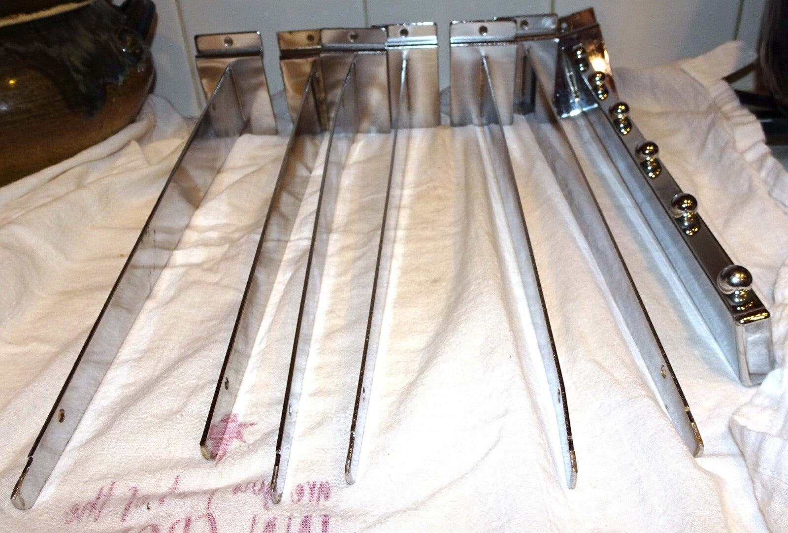 25 Used Assorted Chrome Slat wall Hangers Hooks Holder Hat Brackets Hardware