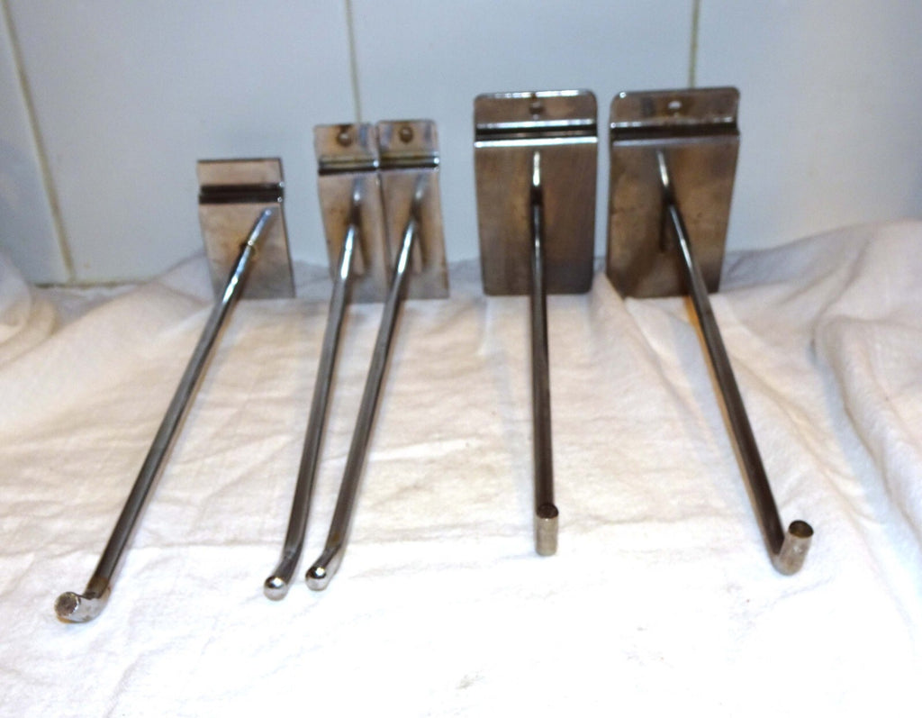 25 Used Assorted Chrome Slat wall Hangers Hooks Holder Hat Brackets Hardware